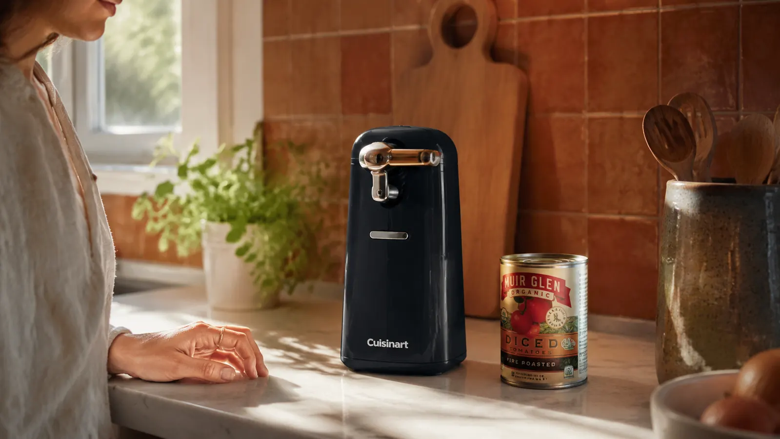 Cuisinart electric can opener on a tidy kitchen counter next to a can of diced tomatoes