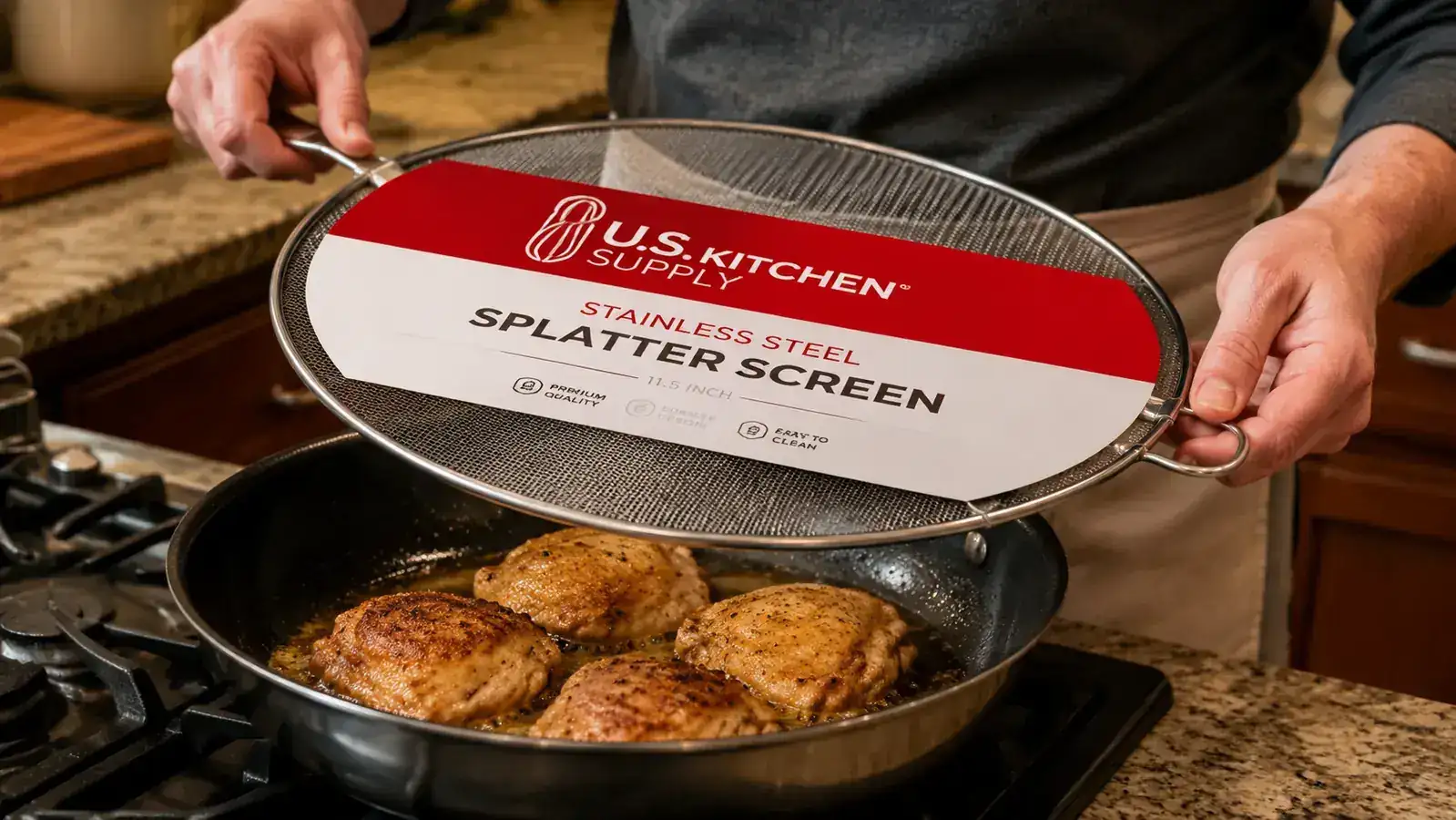 Home cook's hand placing a round stainless steel splatter screen over a pan of frying chicken thighs on a gas burner